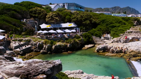 Scenic-Ficks-Restaurant-looking-out-on-tidal-pool-and-rocky-coastline,-Hermanus