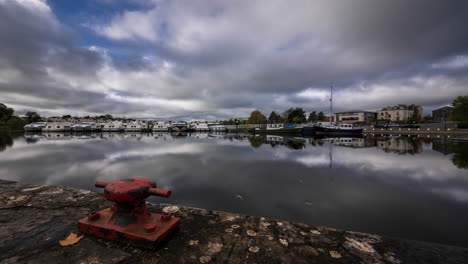 Timelapse-of-Carrick-on-Shannon-town-bridge-in-county-Leitrim-and-Roscommon-with-traffic,-people-and-moving-clouds-on-river-Shannon-in-Ireland