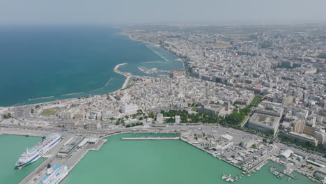 Super-wide-aerial-footage-showing-the-peninsula-of-Old-Town-Bari,-Italy-during-the-bright-day