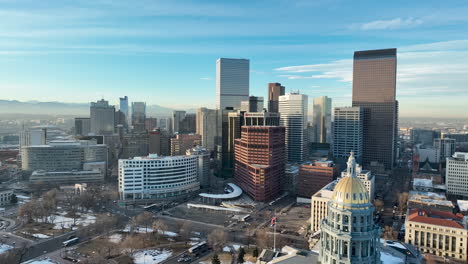 Panoramic-aerial-pullback-over-Colorado-State-Capitol-Building-and-City-of-Denver,-Colorado