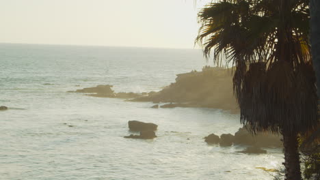 Rock-in-ocean-under-sunlight-near-the-coastline,-Laguna-Beach,-California