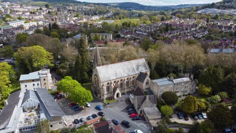 Aerial-overlooking-a-church-in-a-built-up-suburban-area-in-the-UK