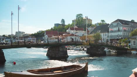 Time-lapse-of-Kragero-city-with-bridge-over-a-canal-in-Norway---static-shot