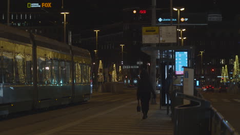 Tram-stop-on-the-streets-with-christmas-light-at-night