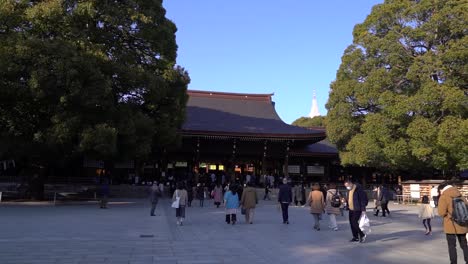 Slow-left-walking-across-wide-Shrine-grounds-at-Meiji-Shrine-in-Tokyo,-Japan