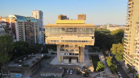 Aerial-rising-over-Buenos-Aires-National-Library-between-Recoleta-buildings-near-Rio-de-la-Plata-at-sunset