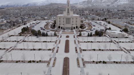 Latter-day-Saints-temple-and-car-park-in-wintery-Utah,-urban-aerial-view
