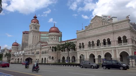 Dataran-Merdeka-traffic-with-Sultan-Abdul-Samad-Building-at-Merdeka-Square-with-bright-blue-sky