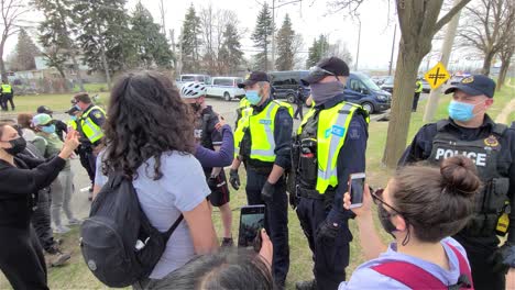 Uniformed-police-officers-form-a-barricade-line-against-civilians-and-reporters