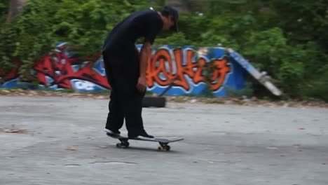 Boys-practice-skateboarding-in-an-abandoned-building-in-Denpasar,-Bali,-October-25,-2021