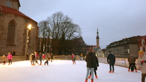 Estonia,-Tallinn,-handheld-video-about-people-skating-in-the-Old-Town-in-the-neighbor-of-St