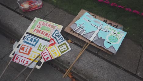 A-close-up-of-two-climate-change-banners-at-Cop26