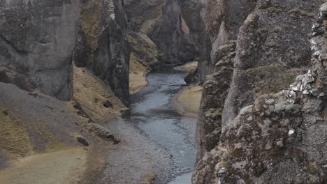 Rocky-walls-of-Fjadrargljufur-Canyon,-Iceland.-Panning