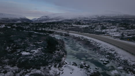 European-Route-E6-Along-River-Driva-In-Dovrefjell,-Norway-During-Winter