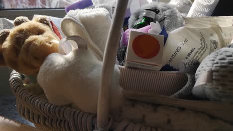 Mother-and-baby-shower-gift-basket-with-fluffy-plush-toys-and-parenting-cosmetics