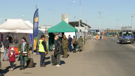 Static-view-of-Ukrainian-refugees-with-volunteers-and-soldiers