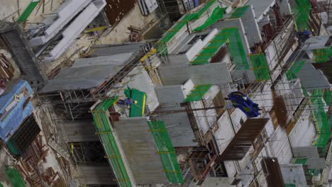 Construction-worker-at-public-housing-construction-site,-Bendemeer,-Singapore