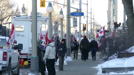 Trucks-and-protesters-block-the-intersection-of-Streets-in-the-context-of-Anti-vaccine-convoy-protests-titled-"Freedom-convoy"-in-Ottawa,-Ontario,-Canada-on-January-30st-2022