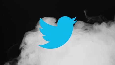 Illustrative-editorial-of-Twitter-icon-appearing-when-smoke-flies-over