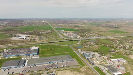 Panoramic-view,-on-the-outskirts-of-the-city-at-roundabout-where-vehicles-run