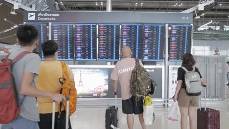 POV-of-flight-information-board-with-cancellation-flight-inside-the-airport-departure-terminal-Suvannabhumi-Airport-while-reopening-country