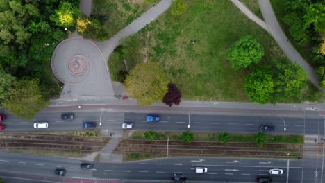Cars-drive-on-the-busy-street-in-the-center-tracks-of-streetcar-Unbelievable-aerial-view-flight-bird's-eye-view-drone-footage
of-Berlin-Prenzlauer-Berg-Allee-Summer-2022