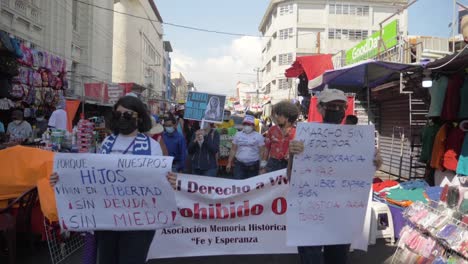 Salvadorans-take-to-the-street-with-banners-in-order-to-peacefully-protest-against-the-current-government---Slow-Motion