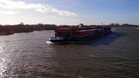 Aerial-View-Of-Millennium-Ship-And-Barge-Carrying-Cargo-Containers-Along-Oude-Maas