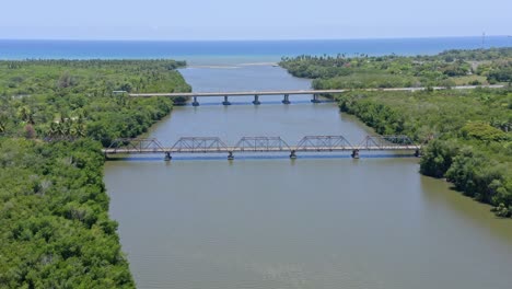 Aerial-View-Of-The-Former-Bridge-With-The-New-Bridge-Over-Rio-Soco-At-San-Pedro-de-Macoris-In-The-Dominican-Republic