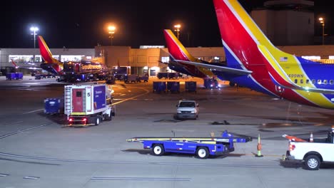 Timelapse-of-Southwest-Airlines-planes-loading-and-unloading-luggage-and-ground-crew-moving-around-terminal-at-the-airport-doing-maintenance-5