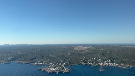 Unique-pilot-point-of-view-during-a-jet-approach-to-Menorca’s-airport-Rwy01,-in-Spain,-Balearic-Islands