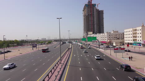 Dubai-UAE-Highway-Traffic,-View-of-Pedestrian-Overpass,-Static-Shot