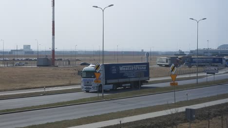 Convoy-of-trucks,-police-escort-carrying-aid-from-Poland-to-Ukraine