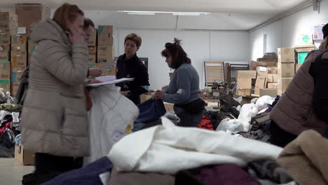 Volunteers-organise-boxes-of-donated-clothing-in-the-Art-Palace-of-Lviv-that-has-been-converted-into-the-largest-aid-centre-in-the-region-during-the-Russian-war-against-Ukraine