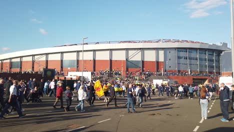Wide-shot-of-football-fans-going-to-Hampden-Park-for-the-Scotland-and-Ukraine-game