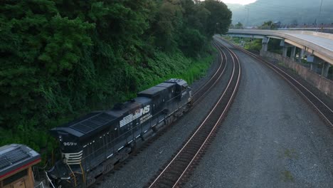 Northfolk-South-diesel-engine-locomotive.-Aerial-tracking-shot