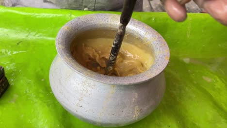 Video-of-a-man-preparing-Sattu-Sharbat,-a-summertime-beverage-prepared-with-roasted-black-chickpea-flour,-sugar,-and-water