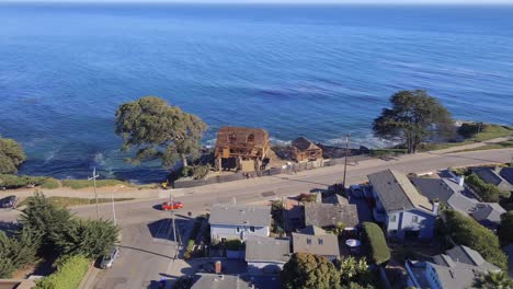 Aerial-View-Of-Beach-House-Construction-On-The-Dangerous-Cliff-In-West-Cliff-Drive,-Santa-Cruz,-California,-United-States---drone-shot