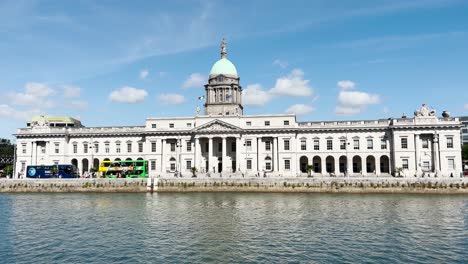 View-across-the-Liffey-River-onto-the-southern-facade-of-Custom-House-in-Dublin-City-on-a-sunny-day-with-blue-skies