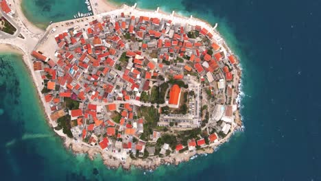 Aerial-drone-view-of-Primosten-old-town-on-the-islet,-Dalmatia,-Croatia
