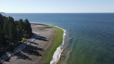 Aerial-view-of-an-empty-pebble-beach-at-the-sunshine-coast-in-British-Columbia