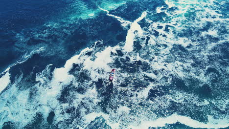 Aerial-vista-of-a-fisherman-in-polluted-sea-in-mejillones