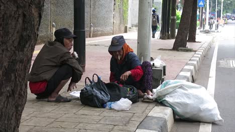 two-scavengers-who-were-resting-on-the-road-during-the-Covid-19-pandemic