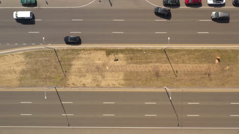 A-top-down-view-directly-over-a-highway-median-on-a-sunny-day