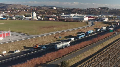 Aerial-view-of-highway-accident,-firefighters-assist-removing-vehicles