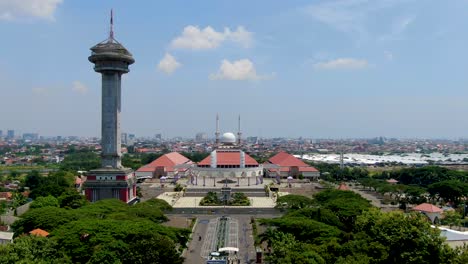 Facade-of-Great-Mosque-of-Central-Java-and-Asmaul-Husna-Tower,-Semarang,-aerial