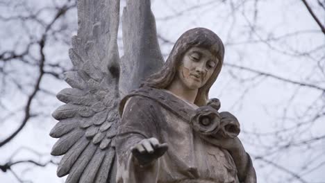 Beautiful-Angel-Carved-from-Stone-with-Broken-Face-Looking-Down