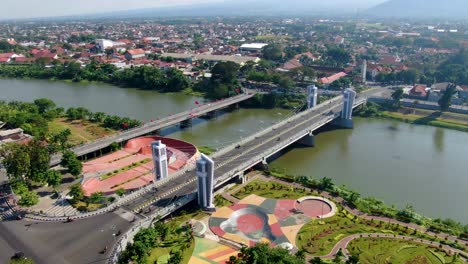 Aerial-panorama-of-Kediri-city-in-East-Java-with-skate-park-and-Brawijaya-bridge