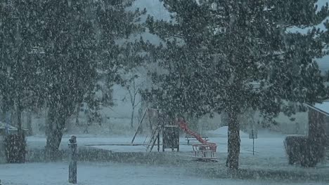 empty-playground-with-snow-falling-in-the-winter-on-a-cold-day-stock-footage