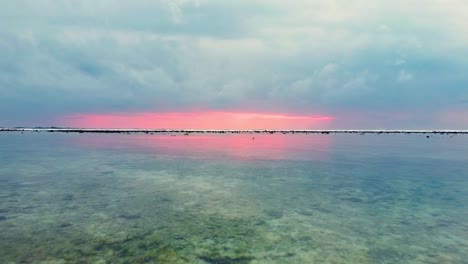 Magical-view-of-mother-nature-showing-backwaters-at-the-seashore,-under-cloudy-pink-sky